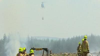 Helicopter fighting fire