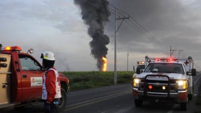 Emergency response vehicles at the site of the blast