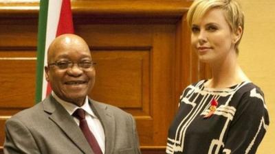 South African president Jacob Zuma and Charlize Theron