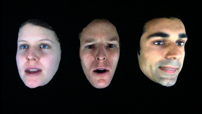 3D graphic of three faces