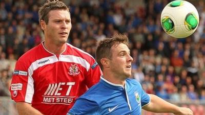 Portadown's Kevin Braniff in action against Linfield's Jamie Mulgrew