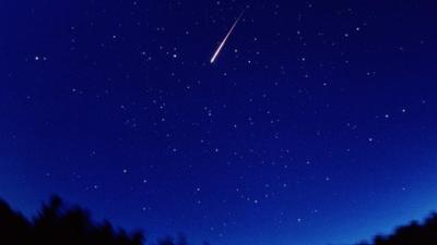 Perseid meteor shooting across night sky