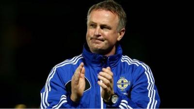 Michael O'Neill applauds the Northern Ireland fans after a 1-0 victory over Russia in Windsor Park