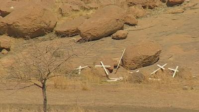 Broken crosses at the site of the Marikana shootings