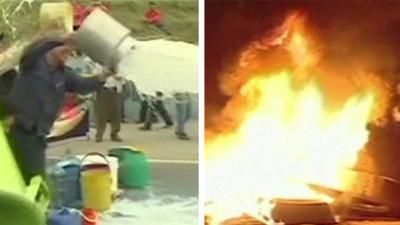 Farmers throw milk while tyres burn amid Colombia protests