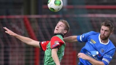 Match action from Glentoran against Ballinamallard