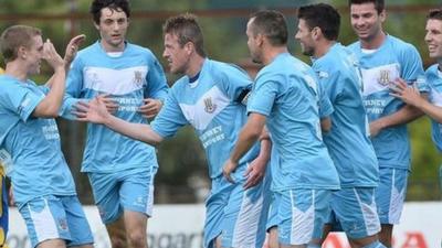 Ballymena United players celebrate victory over Dungannon Swifts