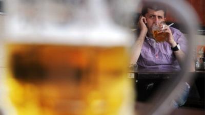 Man drinking a pint of beer