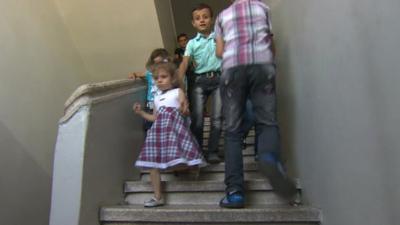 Children play in stairwell