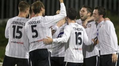 Coleraine players celebrate their 3-1 victory over Cliftonville