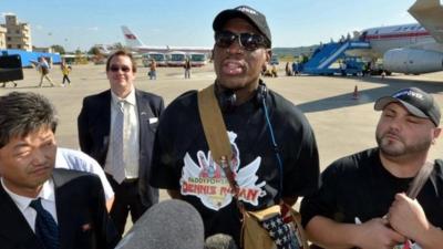 Former basketball star Dennis Rodman (C) arrives at Pyongyang airport, in this photo taken by Kyodo September 3, 2013