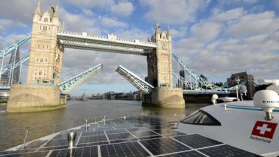 Solar-powered boat approaches Tower Bridge in London