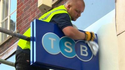 Workman polishes new TSB sign