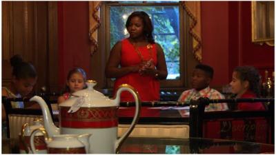Children at a table during an etiquette class in Washington