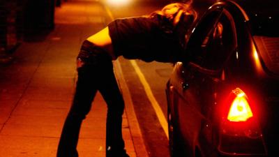 Prostitute at night by car