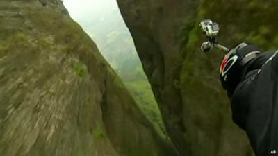 Jeb Corliss performed a jump and dive through a narrow crevasse in the Langshan Mountain in Quzhou