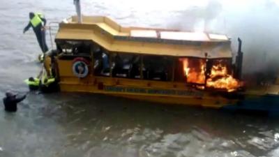 Tourist boat on fire