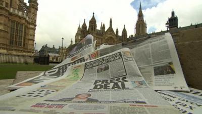 Newspapers with Westminster in background