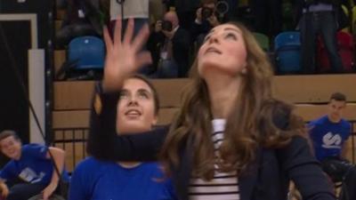 The Duchess of Cambridge reaches for the ball