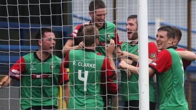 Glentoran players celebrate victory over Coleraine at the Coleraine Showgrounds