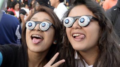 Children wearing googly eye glasses