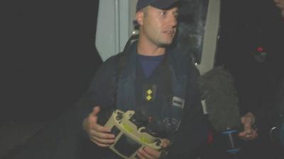 Border patrol crew member with heat-sensing camera