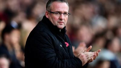 Paul Lambert keeps warm on the touchline during Aston Villa's 0-0 draw at West Ham