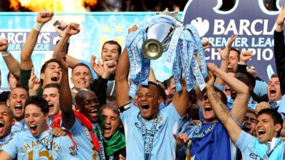 Manchester City lift the 2011/12 Premier League trophy