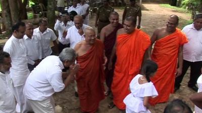 Buddhist monks with officials