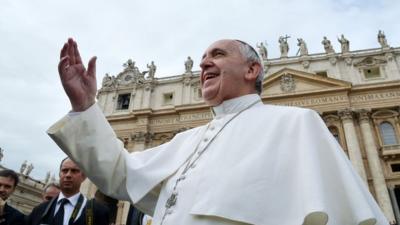 Pope Francis smiles at pilgrims in Saint Peter's square at the Vatican