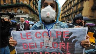 A protester marches in Naples