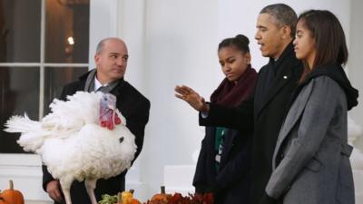 President Barack Obama, with daughters Malia (right) and Sasha, pardoned a turkey at the White House in Washington DC on 27 November 2013