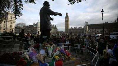 Floral tributes at Nelson Mandela statue in Parliament Square