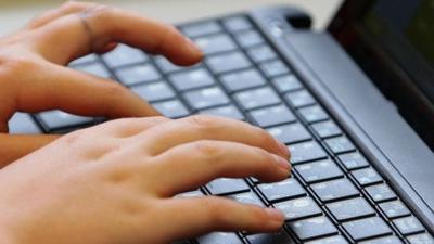 Young person using a laptop