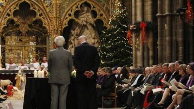 Relatives Jim Swire (L) and William Swire pause after laying a wreath for the victims of the Lockerbie bombing during a service of remembrance to mark the 25th anniversary of the Lockerbie air disaster at Westminster Abbeyon