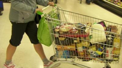 Shopper with full trolley