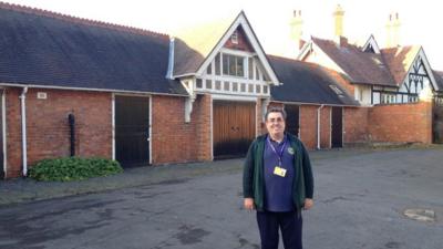 Pigeon historian Colin Hill outside the Bletchley Park pigeon lofts