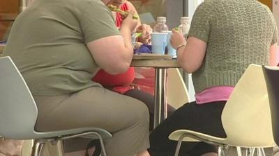 Obese people eating