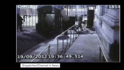 CCTV of Andrew Mitchell at Downing Street gate with bike