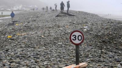 In Pembrokeshire, the main road at Newgale has been closed due to flooding - and this road sign looks lost