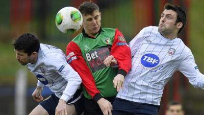 Match action from Glentoran against Coleraine at The Oval