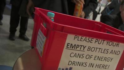 A box for empty cans and bottles of energy drinks