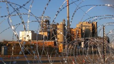 Barbed wire at the entrance to Lonmin's platinum mine in Marikana