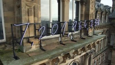 Neon numbers installed on the facade of Bowes Museum