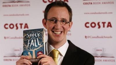 Nathan Filer with his book The Shock of the Fall