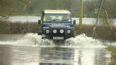 Vehicle in floodwater