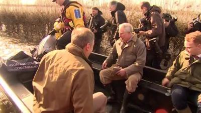 Prince Charles travels to Muchelney in Somerset by boat