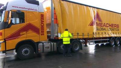 Lorries deliver their goods to a collection point on the edge of Southampton