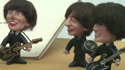 Miniature statues of English rock band The Beatles in Mexico exhibition