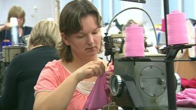 Woman working at swing machine